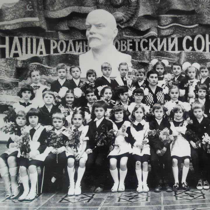 Irina's first grade school photo (Irina is second on the left, bottom row)